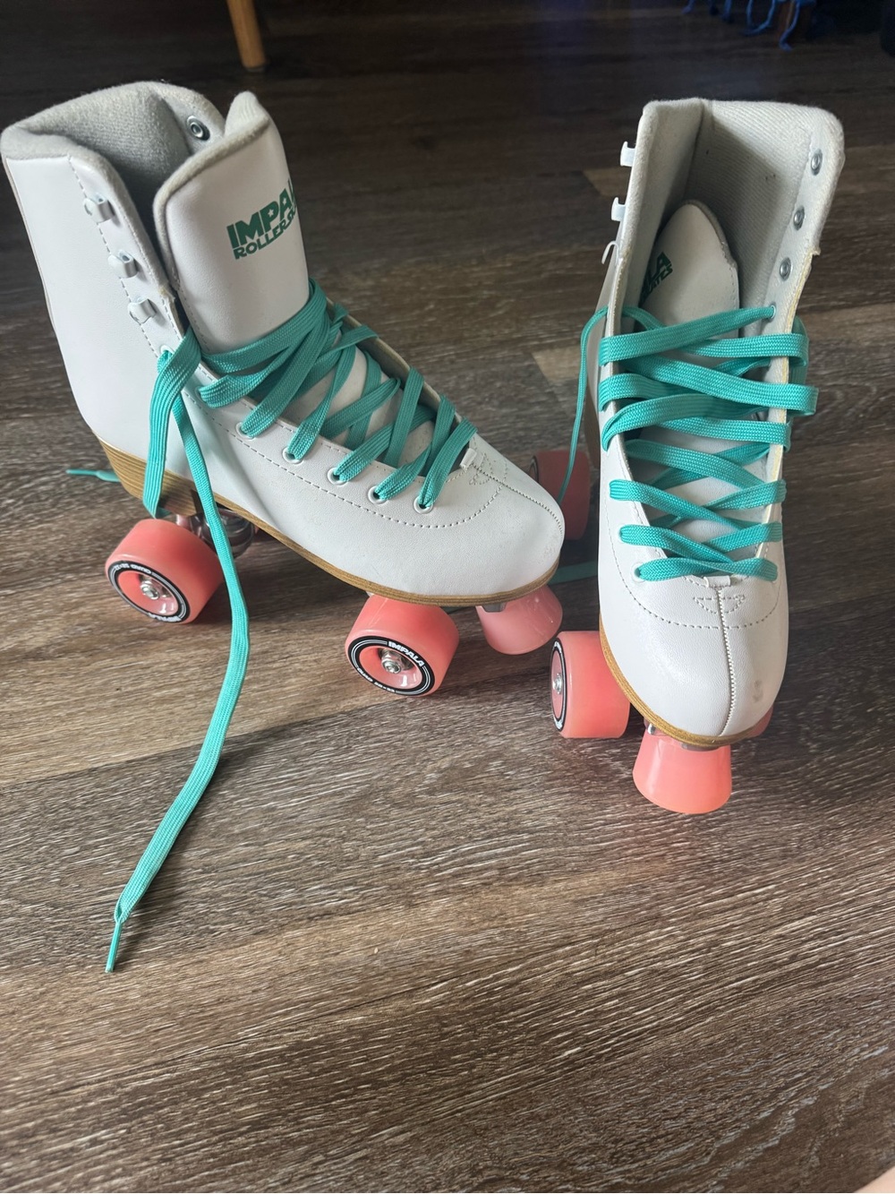 Impala Roller Skates with Teal Laces and Pink Wheels